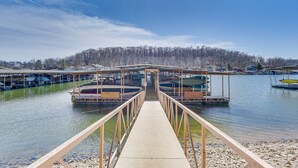 A pier leading to a marina with boats docked. - Lakefront Condo w/ Resort Amenities in Osage Beach (Osage Beach)