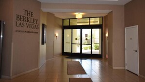 A hotel entrance with a sign reading "The Berkley, Las Vegas" and a glass door leading to the outside. - The Berkley (Las Vegas)
