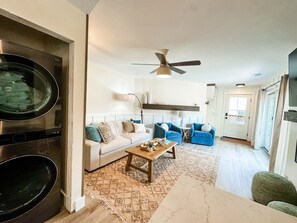 Smart TV, fireplace, books, stereo