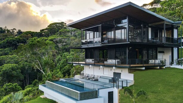 A modern two-story house with a large glass balcony and a swimming pool. - Odyssey Villa - incredible mountain views, 3 bedrooms, w pool! (Peréz Zeledon)