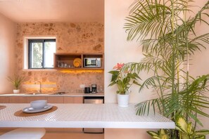Enjoy cooking in this well-equipped kitchen with microwave, coffee maker, and ample counter space.