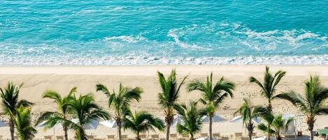 On the beach, sun-loungers, beach towels