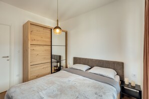 1 bedroom, desk, iron/ironing board, travel crib