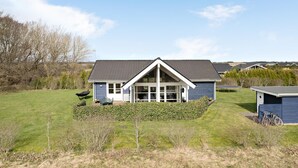 A single-story house with a gabled roof and a large front porch. - 3 bedroom gorgeous home in Storvorde (Storvorde)