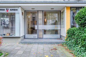 Welcome to PRO AS GMBH, where guests can enter through the glass door.