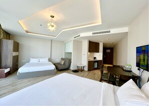 Executive Quadruple Room, Bathtub, Sea View | Hypo-allergenic bedding, individually furnished, desk, laptop workspace