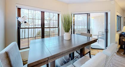 Lakefront condo with balcony, fireplace, washer/dryer, central AC, & fast WiFi