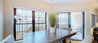Lakefront condo with balcony, fireplace, washer/dryer, central AC, & fast WiFi