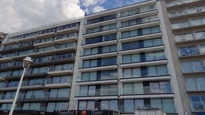 A multi-story building with balconies and large windows. - Apartment in Nieuwpoort by the North Sea (Nieuwpoort)