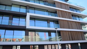 A multi-story building with large windows and a modern design.