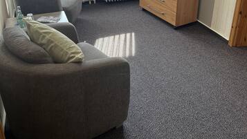 Chambre Confort | Coin séjour