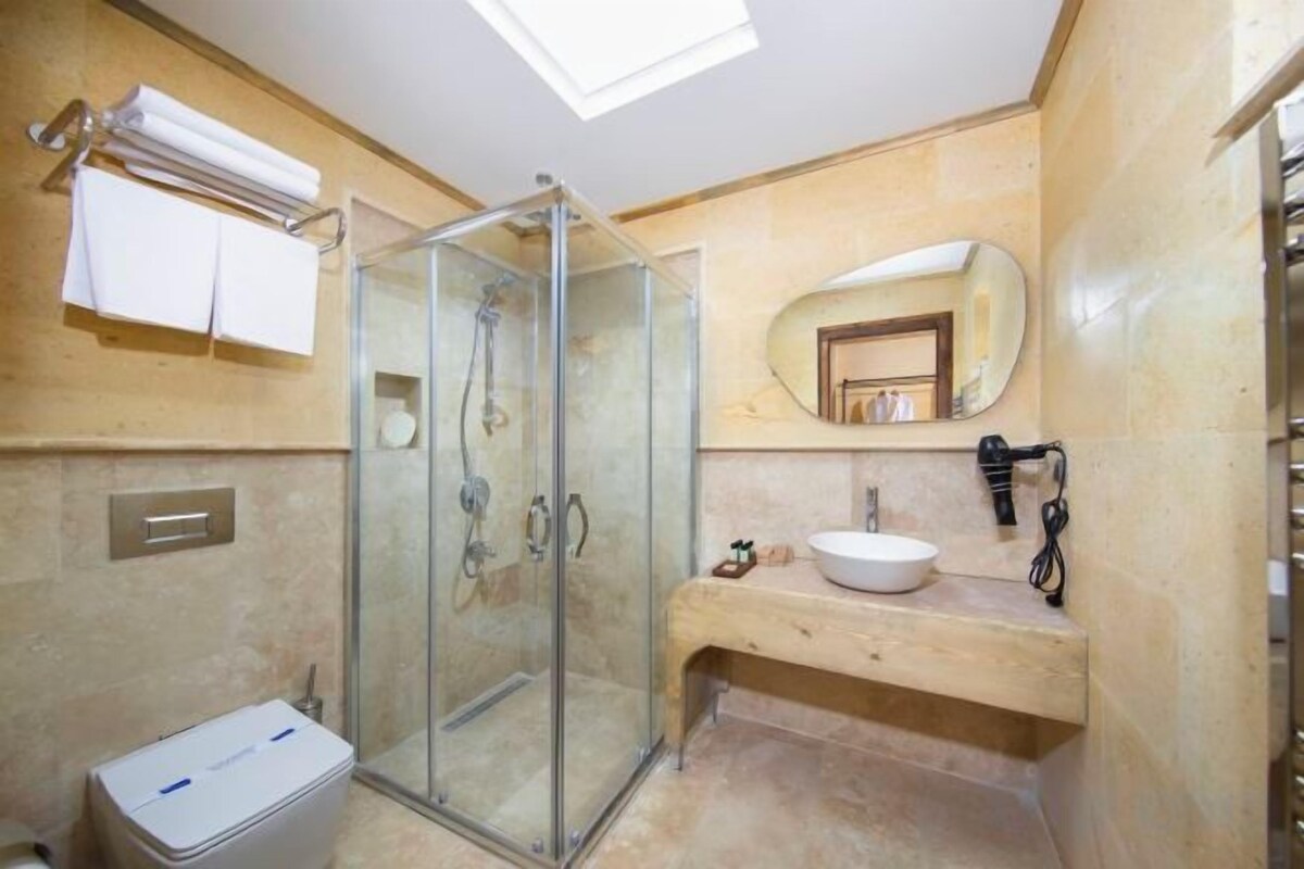 Bathroom | Designer toiletries, hair dryer, bathrobes, slippers