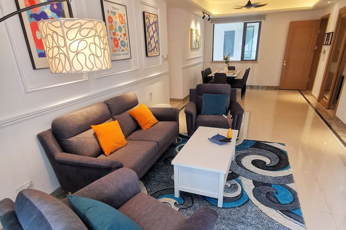 Habitación cuádruple Deluxe | Área de sala de estar