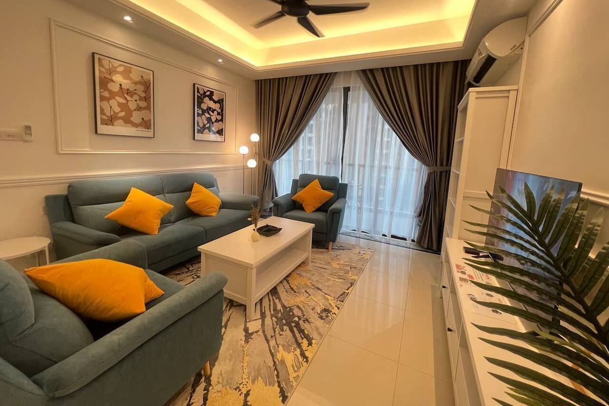 Habitación triple junior | Área de sala de estar