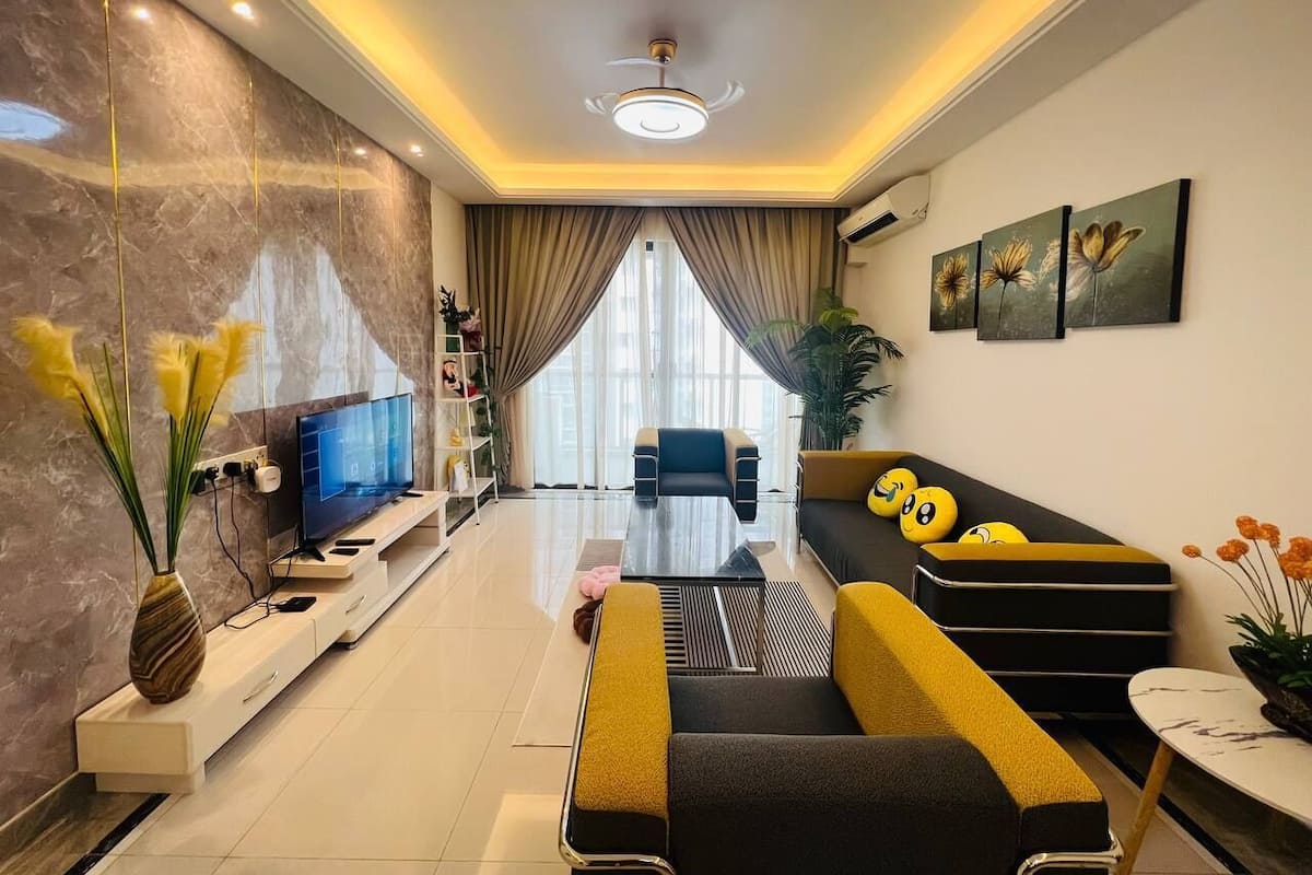 Habitación triple exclusiva | Área de sala de estar
