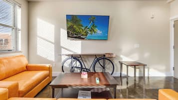 Premium Apartment | Living area | 65-inch Smart TV with digital channels, Netflix, Hulu