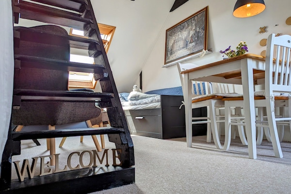 Entrance to the room from the stairway from downstairs