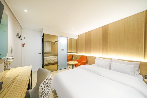 Premium bedding, memory-foam beds, desk, laptop workspace