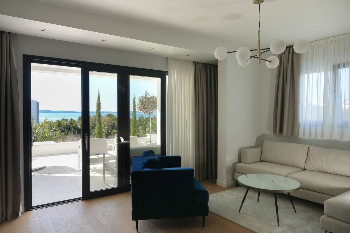 Deluxe Apartment, 2 Bedrooms, Sea View | Living area | 43-inch Smart TV with satellite channels