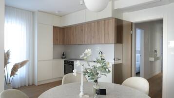 Deluxe Apartment, 2 Bedrooms, Sea View | Private kitchen | Full-size fridge, oven, stovetop, dishwasher