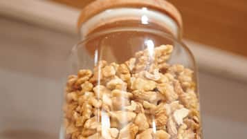 A glass jar filled with granola.