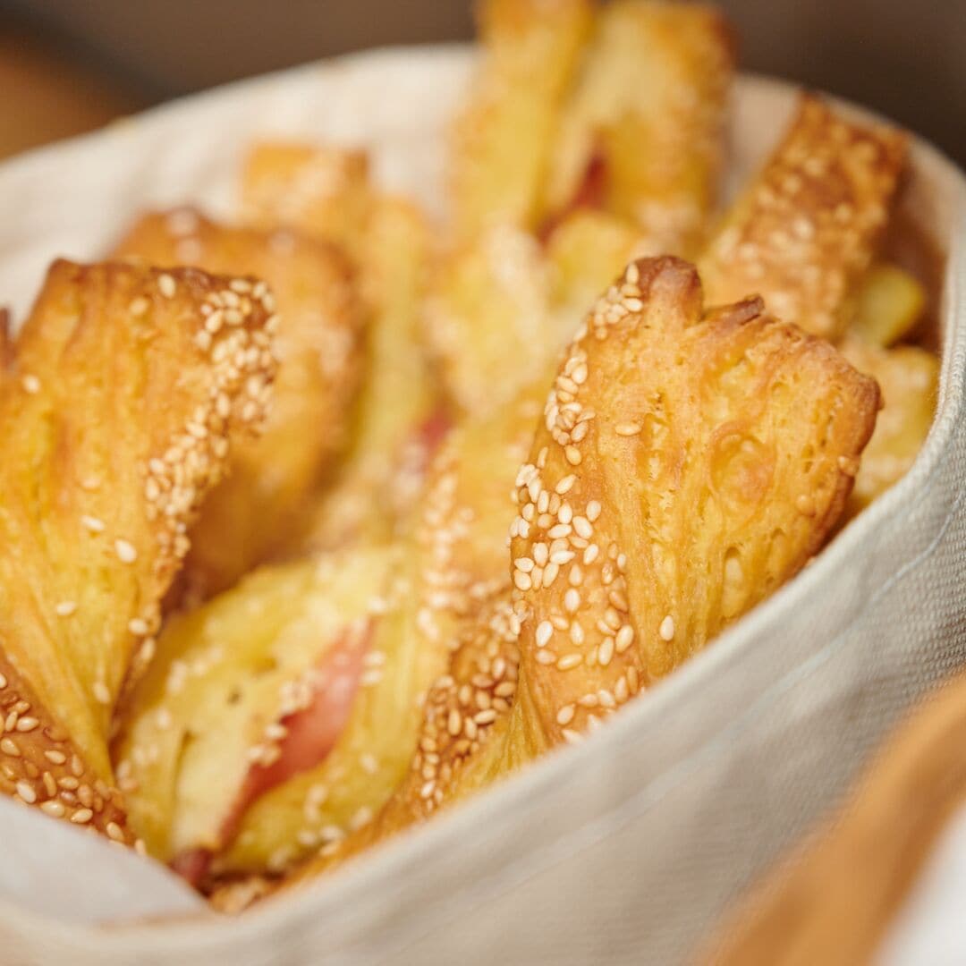 A bowl of bread with sesame seeds.