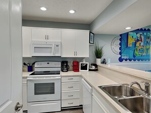 Fridge, microwave, oven, stovetop - Edgewater Villa #2012 | Lush Golf Course Views + Resort Amenities (Panama City Beach)