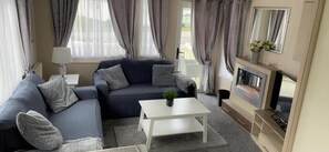 Cabin | Living area | Fireplace - Captivating 3-bed Cabin in Rhyl (Rhyl)