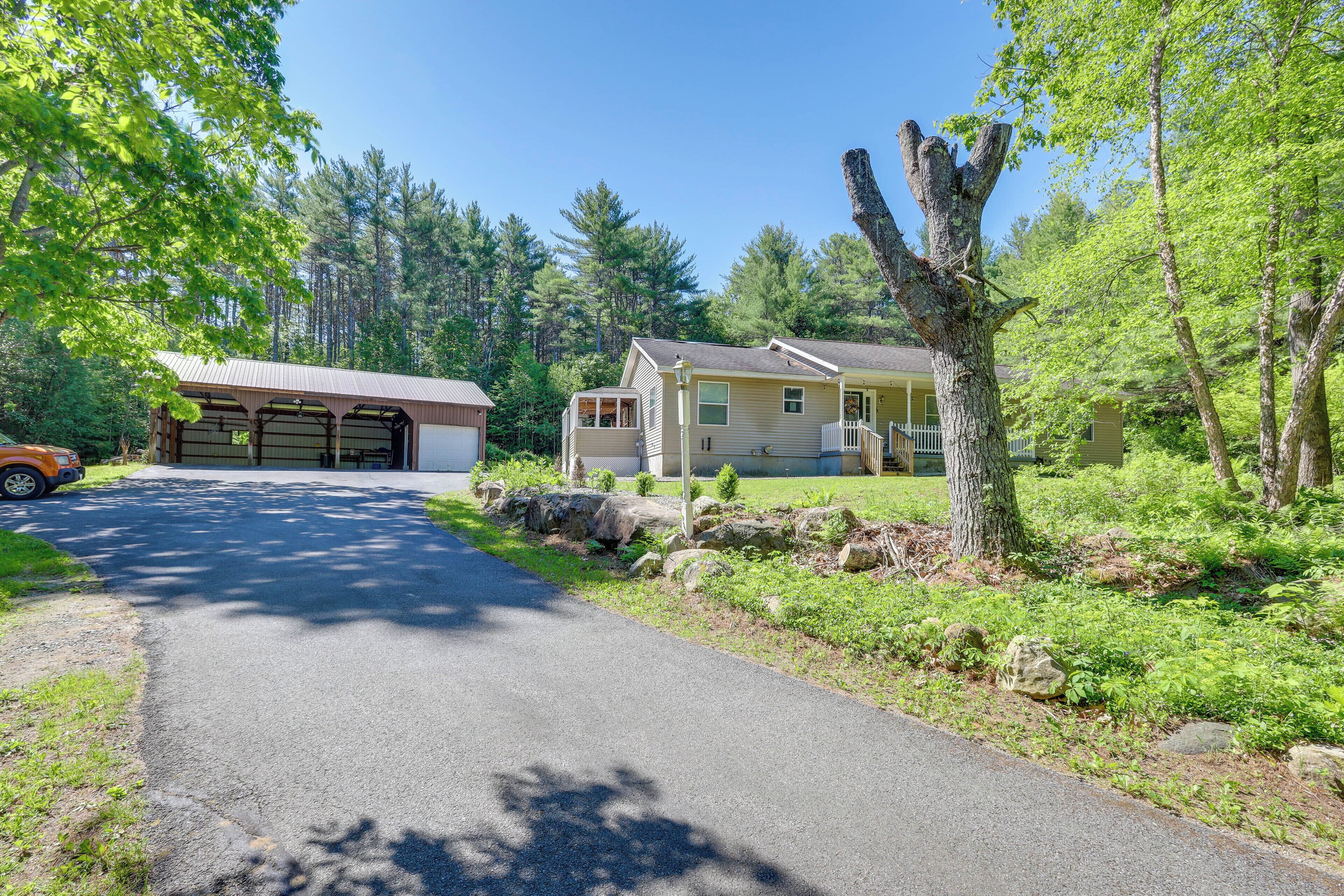 A residential property with a garage, a house, and a driveway.