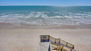 A wooden boardwalk leading to the beach with a clear view of the ocean. - North Topsail Beach Condo w/ Ocean-view Balcony! (Sneads Ferry)