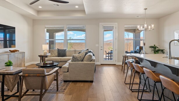 A spacious living area with a sofa, chairs, a coffee table, and a bar area with stools. - Crown Point: Ping Pong, Foosball, Hot Tub, Community Pools (Washington)