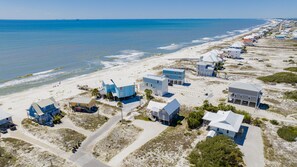 An aerial view of a coastal residential area with houses adjacent to the beach. - Pet Friendly | Gulf Views | Golf Cart | Deeded Beach Access (Gulf Shores)