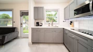 Fridge, microwave, stovetop, coffee/tea maker