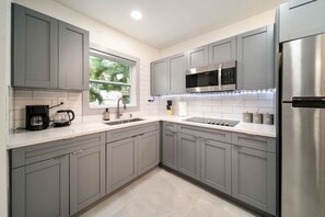 Fridge, microwave, stovetop, coffee/tea maker