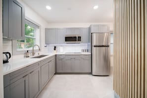 Fridge, microwave, stovetop, coffee/tea maker