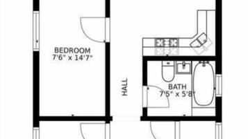 A floor plan with a utility room, kitchen, two bedrooms, a living room, a foyer, and a bathroom.
