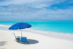 On the beach, sun-loungers, beach towels