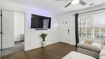 Townhome | Living area | 70-inch Smart TV with digital channels, smart speakers