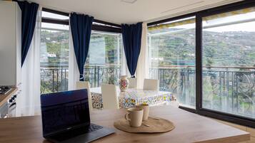 Panoramic Villa | Living area | 50-inch flat-screen TV with digital channels