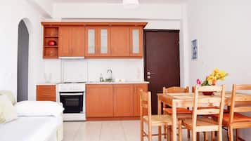 Family Apartment, Sea View | Private kitchen | Mini-fridge, oven, cookware/dishes/utensils, cleaning supplies