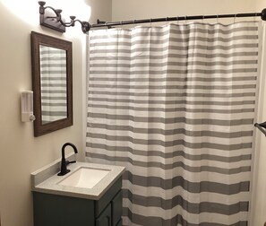 Shower, towels, soap, toilet paper