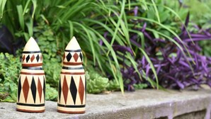 Two decorative ceramic vases with geometric patterns on a stone ledge. - Room in B&B - Amahoro Guest House Triple Room With Shared Bathroom (Muhoza)