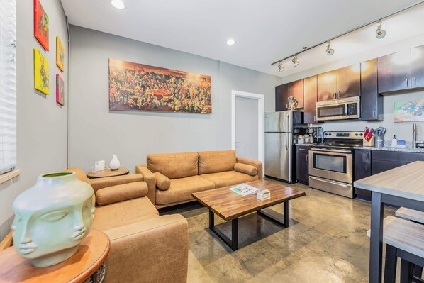 TV, fireplace, offices - The West End Flats (Roanoke)