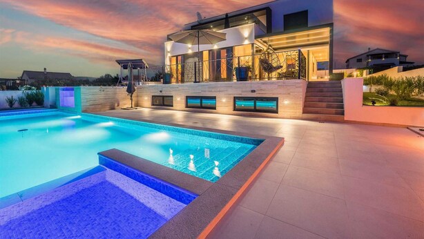 A modern house with a swimming pool, a covered patio, and a staircase leading to the upper floor. - Villa Summer Dream - luxury and adventure by MyWaycation (Vrana)