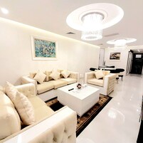 Family Suite | Living area | 32-inch Smart TV with cable channels, fireplace