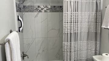 Hair dryer, towels, soap, shampoo