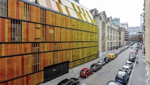A modern building with a unique facade featuring vertical panels in various colors. - Splendid Apartment in the Very Center Paris / Great for Olympic Games 2024 (Paris)