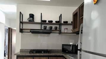 Fridge, microwave, stovetop, coffee/tea maker