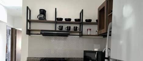 Fridge, microwave, stovetop, coffee/tea maker