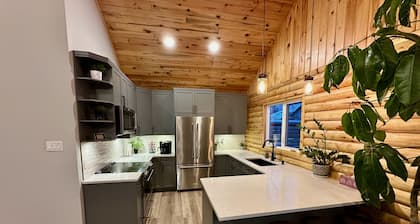 Waterfront Log Home with Beach and Hot Tub. Pet Friendly!